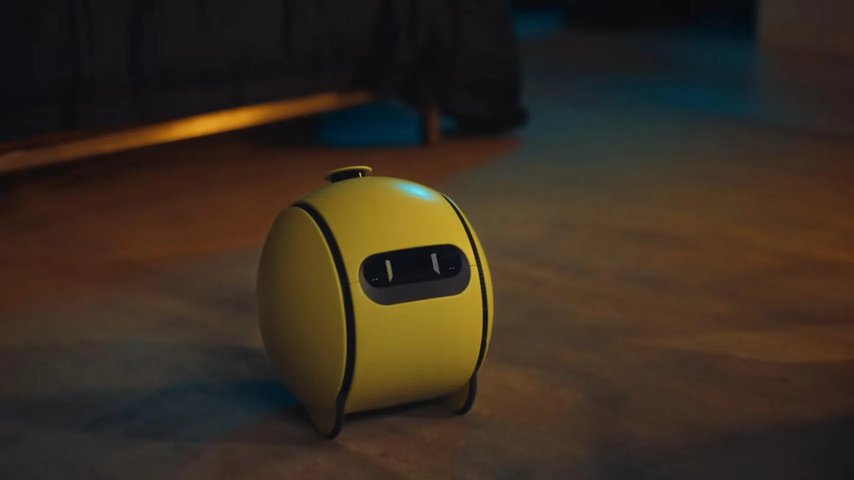 Samsung Ballie, a spherical mobile companion robot with AI capabilities, rolling on a home floor